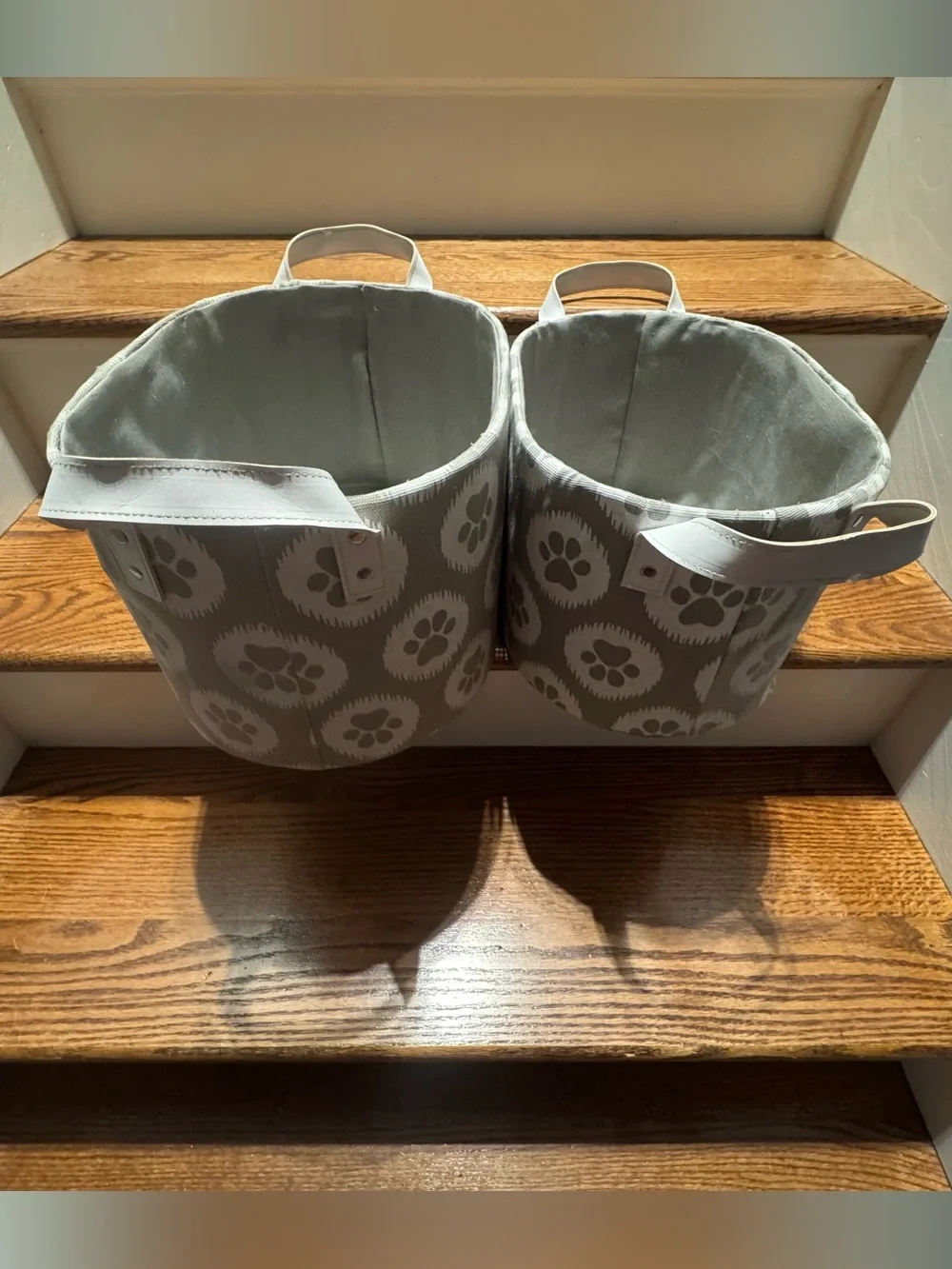 Set of gray & white paw print canvas storage baskets with white leather handles